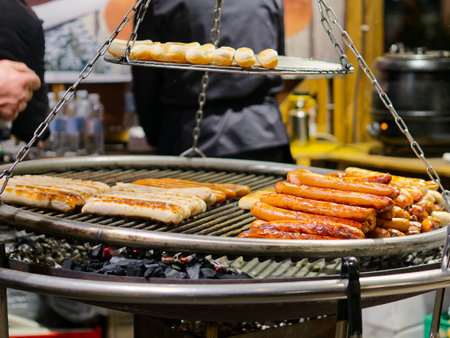 Traditional BBQ barbecue wurst sausages street food on Christmas market in Copenhagen, Denmarkの写真素材