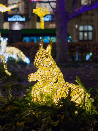 illuminated Christmas squirrel sculpture decorated with Christmas lightsの写真素材