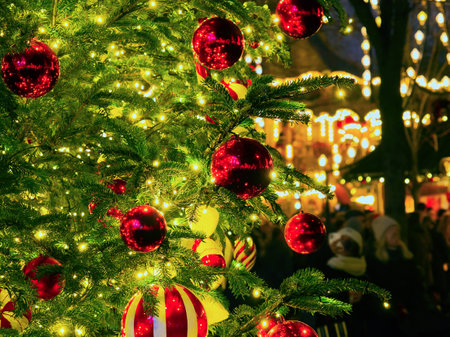Christmas tree hanging ornaments and lights high quality close-up photoの写真素材