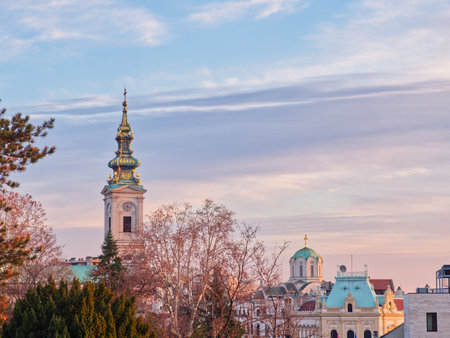 Scenic view of Belgrade architecture with prominent church towers against a pastel skyの写真素材