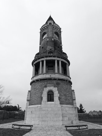 Imposing brick and stone Gardos tower in Zemun with circular balcony and conical roof against overcast sky. Belgrade, Serbiaの写真素材