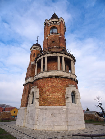 Impressive brick Gardos tower in Zemun with circular balcony, twin spires, and decorative stonework against blue sky. Belgrade, Serbiaの写真素材