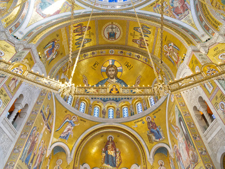 Stunning Byzantine cathedral dome with intricate gold mosaics depicting religious figures and scenes. Church of Saint Sava, Belgradeの写真素材