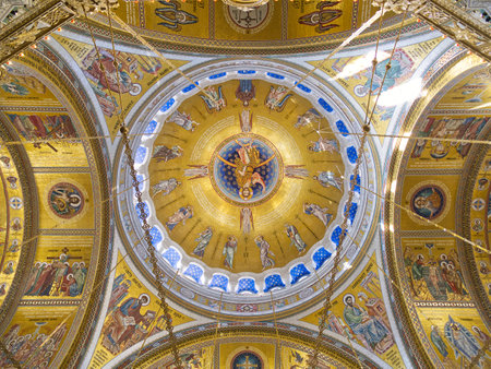 Richly decorated golden dome with religious iconography, frescoes, and intricate architectural details. Church of Saint Sava, Belgradeの写真素材