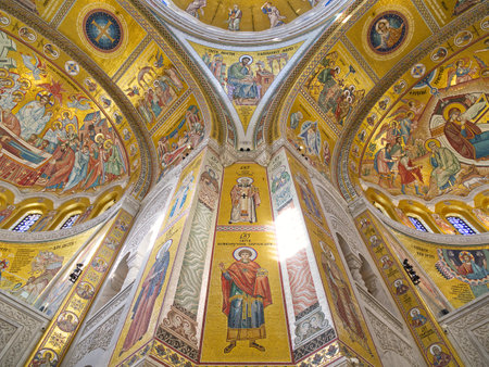 Stunning interior of a Byzantine-style church with elaborate gold mosaics depicting religious scenes. Church of Saint Sava, Belgradeの写真素材