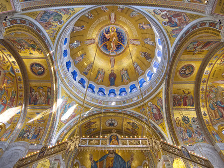 Intricate golden dome of a cathedral with elaborate religious frescoes and mosaics. Church of Saint Sava, Belgradeの写真素材