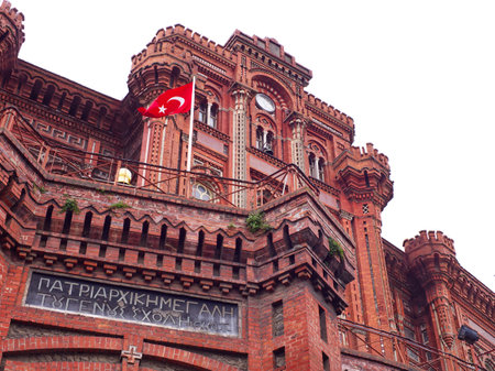 Private Fener Greek High School with Turkish flag, featuring Byzantine architecture and Greek inscription. Instabul, Turkeyの写真素材