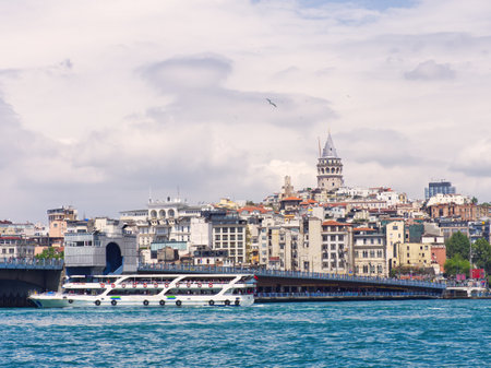 Panoramic view of Istanbul's waterfront with historic buildings and Galata Tower rising above the skylineの写真素材