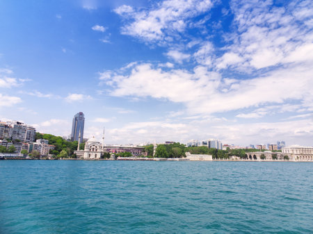 View of Istanbul's waterfront with historic buildings and modern skyscrapers along the Bosphorus straitの写真素材
