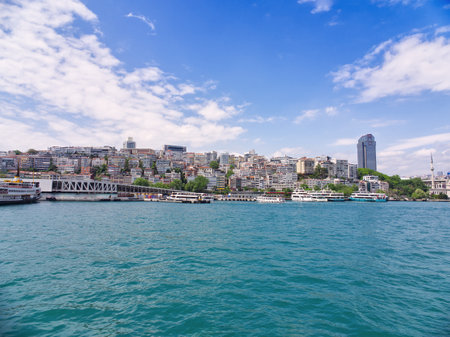 Panoramic view of Istanbul cityscape with buildings and boats along the Bosphorus straitの写真素材