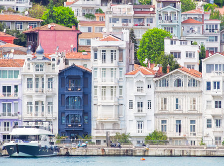 Vibrant historic buildings along the Bosphorus in Istanbul, featuring diverse architectural stylesの写真素材