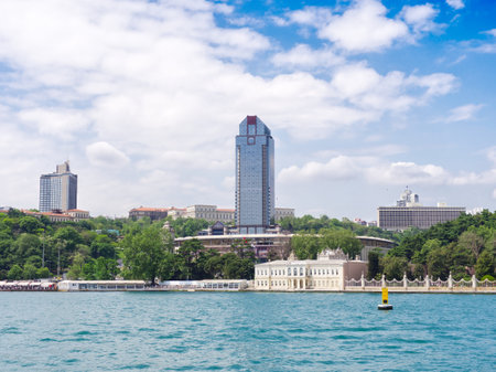 View of Istanbul's modern skyline and historic buildings along the Bosphorus strait with blue waterの写真素材