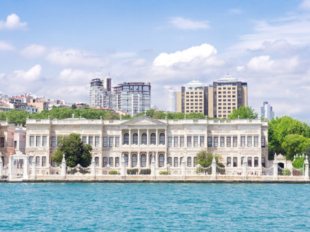 Dolmabahce Palace on Bosphorus strait with modern buildings in background, Istanbul, Turkeyの写真素材