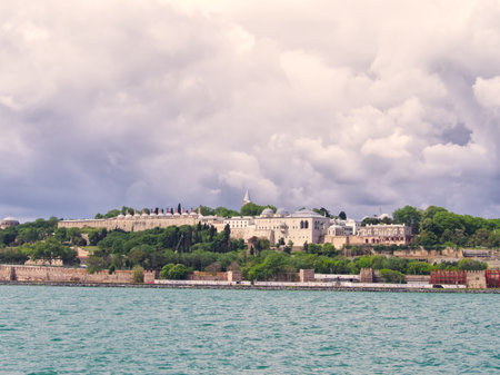 Topkapi Palace complex viewed from the Bosphorus, with lush gardens and Ottoman architectureの写真素材