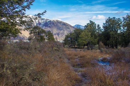 Looking out over a river and snow capped mountains in mid Canterbury New Zealandの写真素材