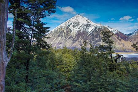 Looking out over a river and snow capped mountains in mid Canterbury New Zealandの写真素材