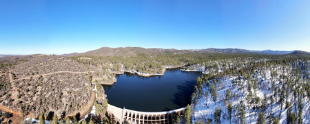 An aerial panorama over Upper Goldwater Lake, after a light dusting of snow, in the Prescott National Forest, just outside of Prescott, Arizona.の写真素材