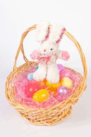 Easter basket wih colorful eggs and a bunnyの写真素材