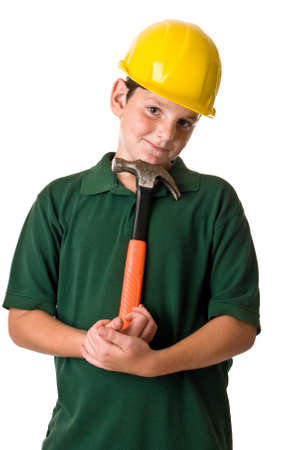 A young boy wearing a hard hat and holding a hammer while in thought isolated on a white background.の写真素材