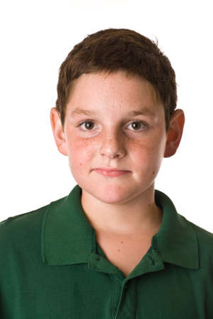 Young boy wearing a green polo shirtの写真素材