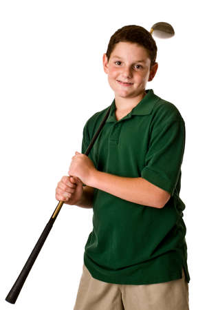 A threequarter view of a young boy holding a golf driver over his shoulder isolated on a white background.の写真素材
