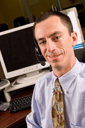Caucasian Male Receptionist with Headsetの写真素材