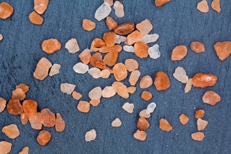 Himalayan salt splattered around on a piece of slate