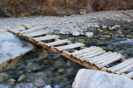 Rickety Old Bridge over stream (1)の写真素材