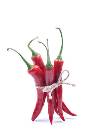 Red chili pepper on white ground の写真素材
