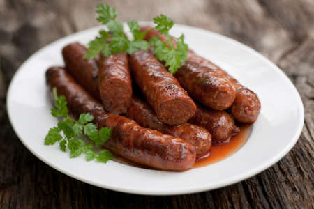 Frying sausage with lambの写真素材