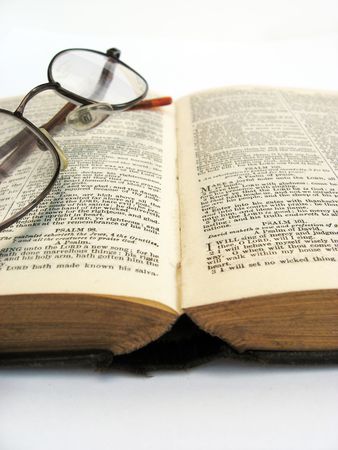 a book and glasses on a plain backgroundの写真素材