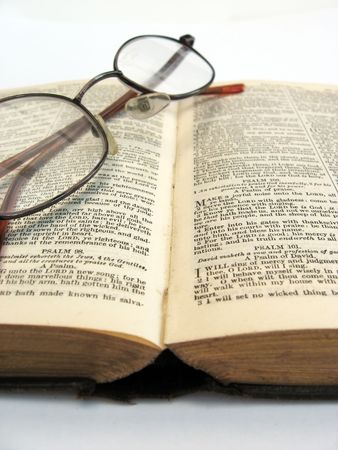 closeup photograph of a book and glassesの写真素材