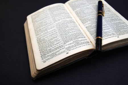 closeup of open book on dark backgroundの写真素材