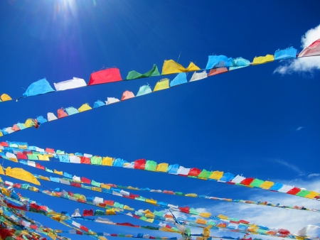 Lama Buddhist prayer flags in the highlands of Tibetの写真素材