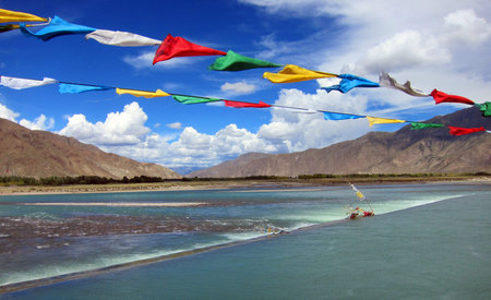 Lama Buddhist prayer flags in the highlands of Tibetの写真素材