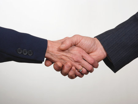 Close up of business handshake, one female  and one male hand