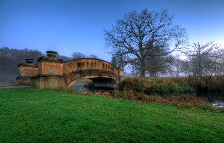 an old bridge in a parkの写真素材