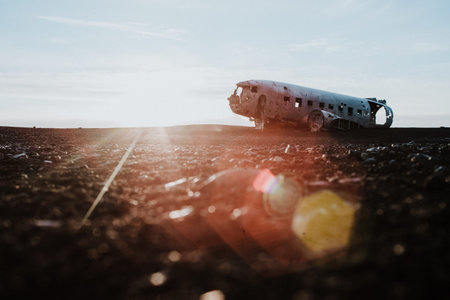 The famous plane wreck in Iceland at a black sand beach at sunset