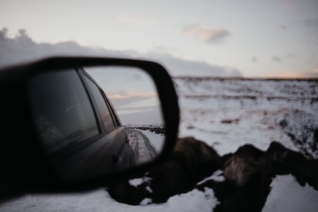 Looking onto an Icelandic landscape through the back of a car.の写真素材
