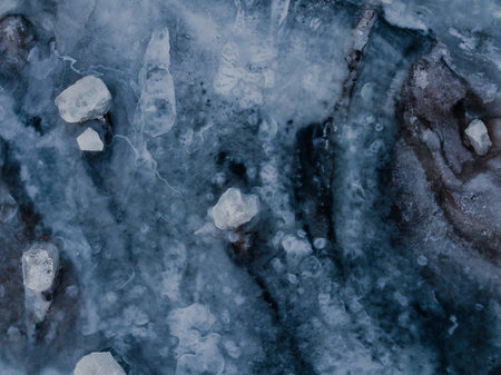 The structure of a frozen lake in Iceland with many ice blocks