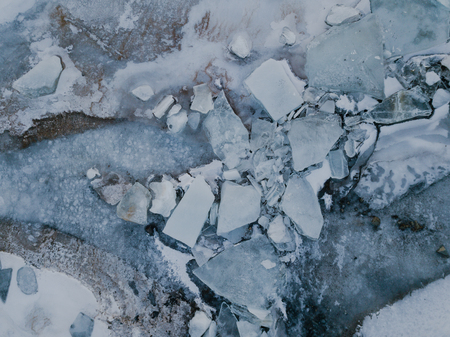 The structure of a frozen lake in Iceland with many ice blocksの写真素材