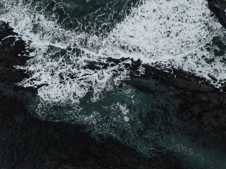 A drone capture of the waves at Stokksnes, Iceland, directly form above.の写真素材