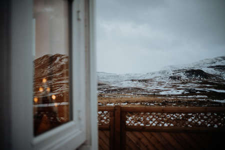 Standing next to a cabin, looking onto a landscape in Snaefellsnes, Iceland.の写真素材