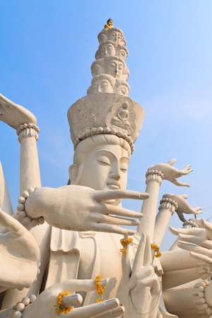 Multi armed statue in thailand templeの写真素材