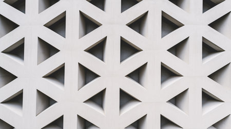 Amidst the Middle Eastern skyline, a concrete building with a contemporary, geometric design stands out, its abstract architectural features drawing the eye. Generative Aiの素材