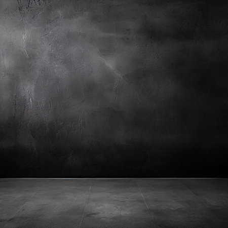 Step into the atmospheric depth created by a black wall texture against a dark concrete floor embodying an old grunge background.の素材