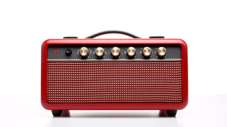 A vintage-style wireless speaker, resembling an electric guitar amplifier, stands out on a white backdrop.の素材