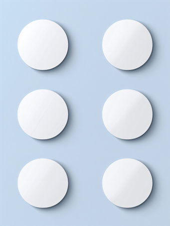 Realistic mockup of round stickers on a textured surface, with ample space for tape or badge designs.の素材