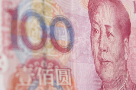 Macro-shot for Renminbi  RMB  , 100 hundred dollar  Mao s eyes gaze at the number  100  