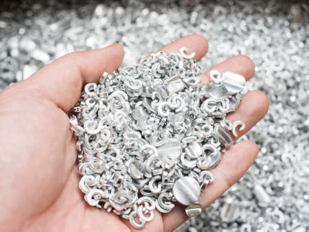Scrap metal aluminum in handの写真素材